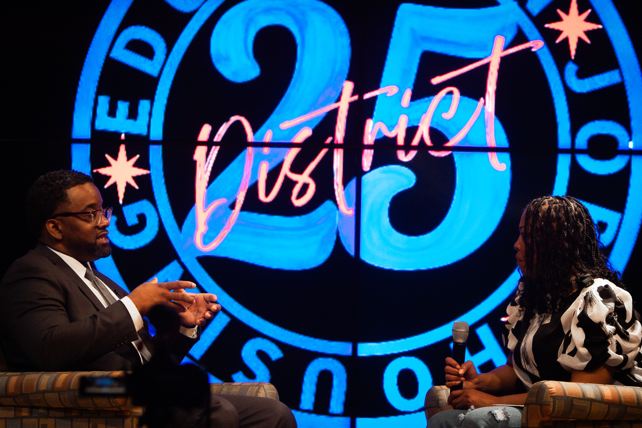 April listening during a seated conversation with a guest